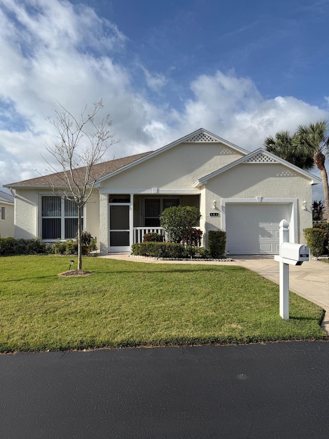 ranch-style house with driveway, a front lawn, an attached garage, and stucco siding