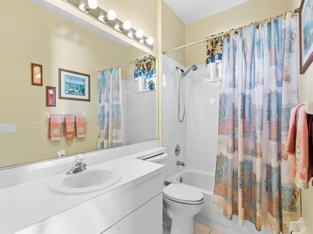 bathroom with toilet, shower / bath combo with shower curtain, vanity, and tile patterned floors