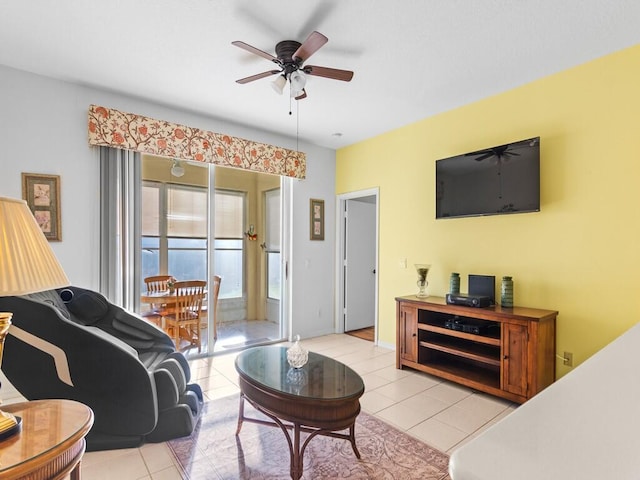 living room featuring a ceiling fan and light tile patterned floors