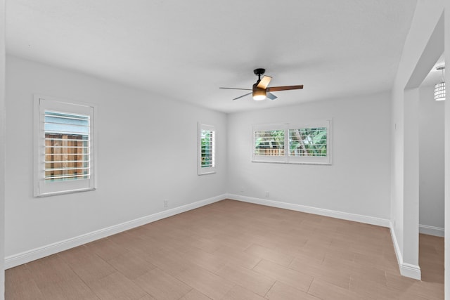 unfurnished room with ceiling fan