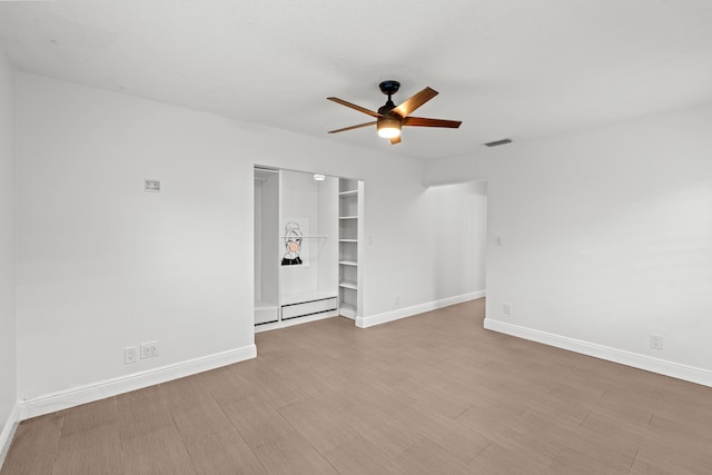 unfurnished room featuring light hardwood / wood-style flooring and ceiling fan