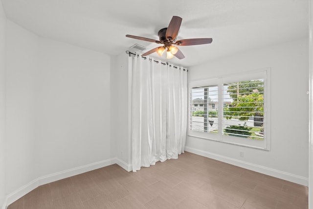 spare room featuring ceiling fan