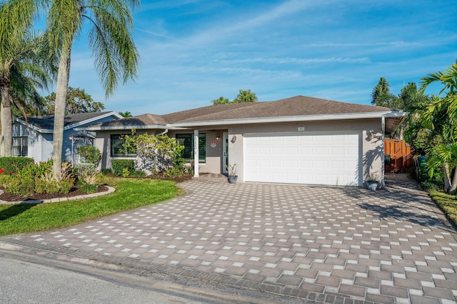 single story home with a garage