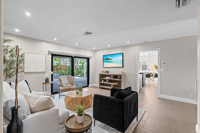 living room with a textured ceiling