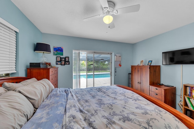 bedroom with a textured ceiling, access to outside, and ceiling fan