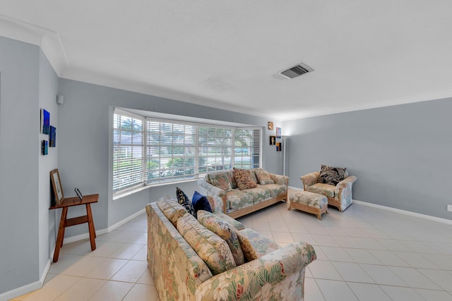 living room featuring crown molding and light tile patterned flooring