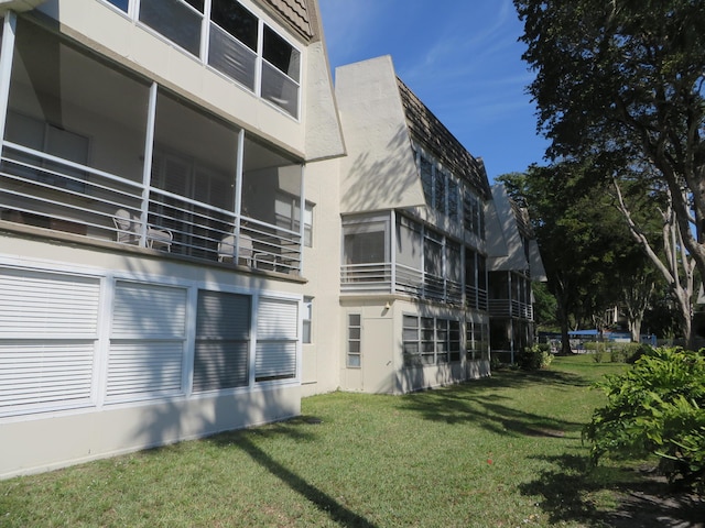 view of side of property with a yard