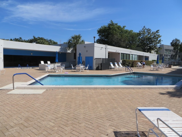 view of swimming pool featuring a patio area