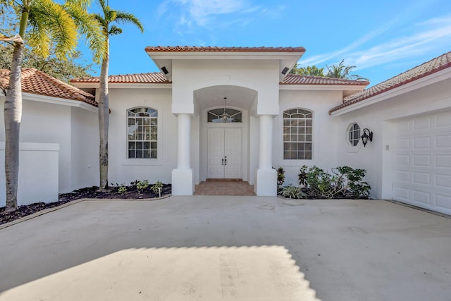 doorway to property featuring a garage