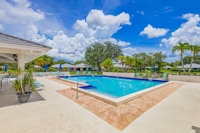 view of swimming pool featuring a patio