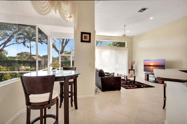 dining room featuring light tile patterned floors and ceiling fan