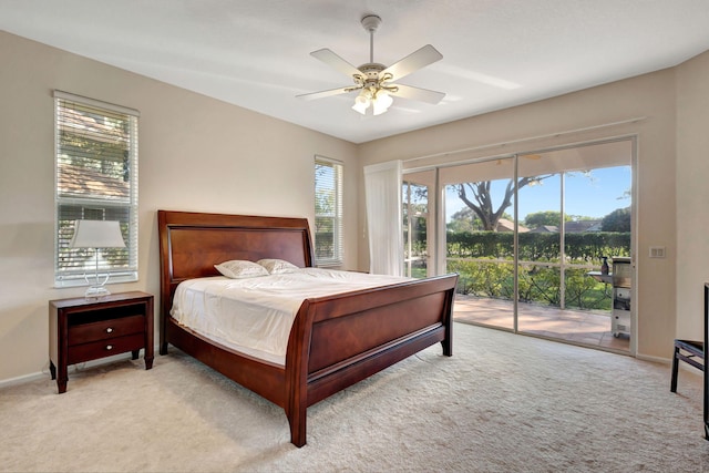 carpeted bedroom featuring access to exterior and ceiling fan