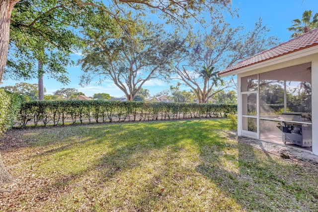 view of yard with a sunroom