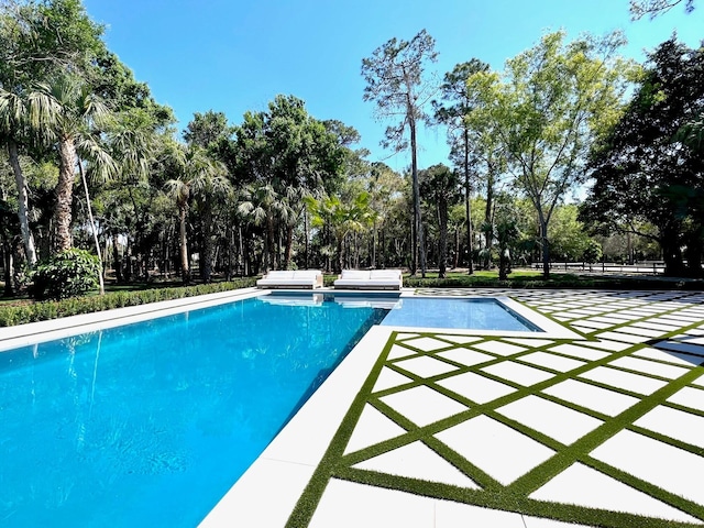 outdoor pool featuring a patio