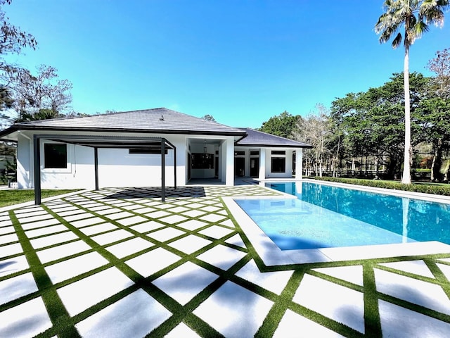 outdoor pool with a patio area