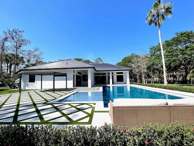 outdoor pool with a patio area