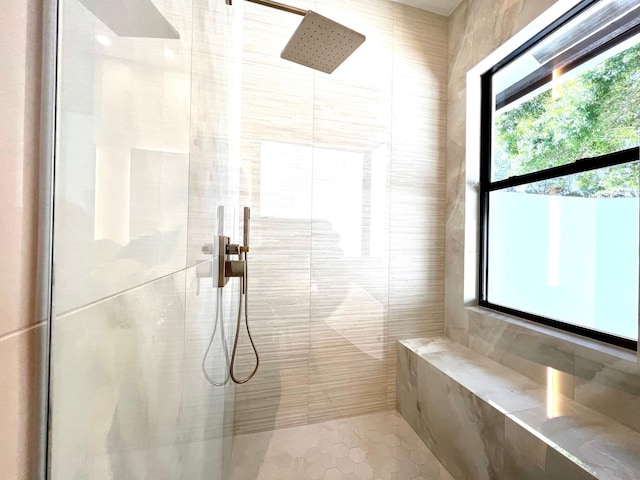 bathroom with a tile shower