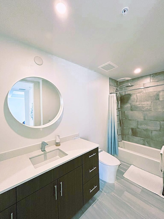 full bathroom with shower / bathtub combination with curtain, vanity, and toilet