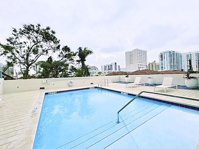 view of swimming pool featuring a patio