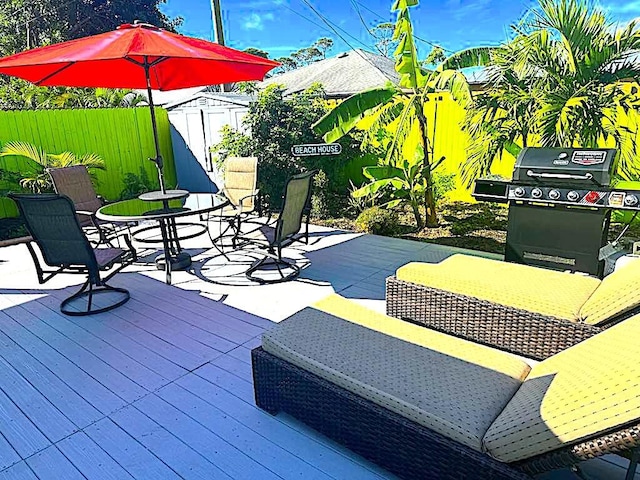 deck featuring grilling area and an outdoor living space