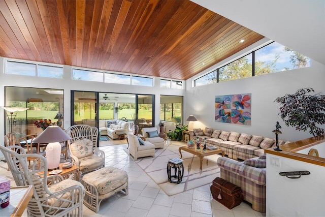 tiled living room featuring wood ceiling and a high ceiling