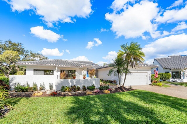 view of front of house featuring a garage and a front yard