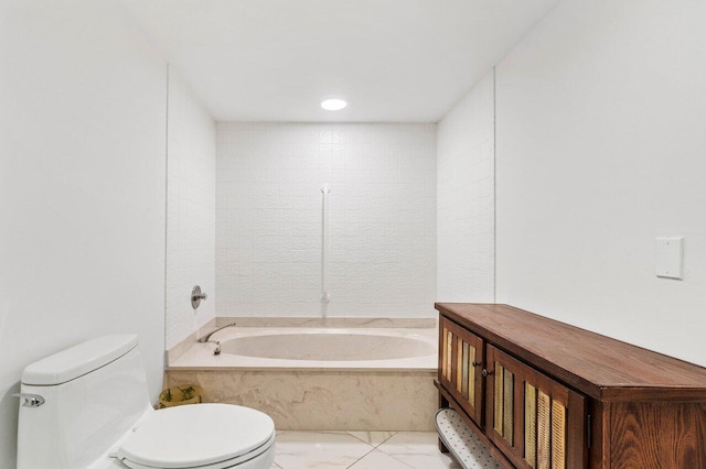 bathroom featuring a relaxing tiled tub and toilet