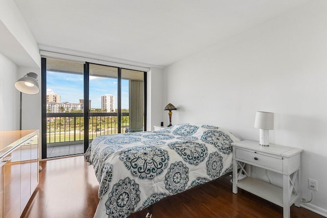 bedroom featuring floor to ceiling windows and access to outside