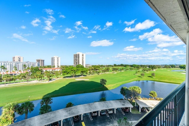 view of home's community with a lawn and a water view