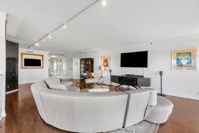 living room featuring crown molding, wood-type flooring, and rail lighting