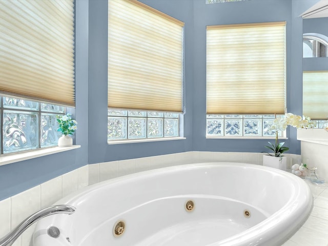 bathroom featuring tiled tub