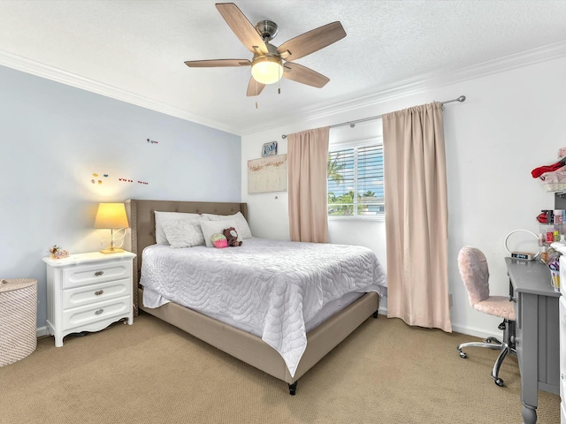 carpeted bedroom featuring ceiling fan, ornamental molding, and a textured ceiling