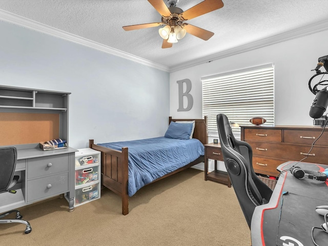 carpeted bedroom featuring ornamental molding, ceiling fan, and a textured ceiling