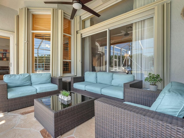 view of patio / terrace with an outdoor living space and ceiling fan