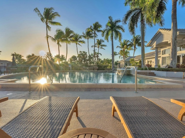 view of pool at dusk