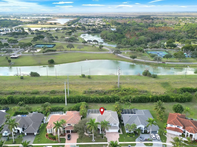 birds eye view of property featuring a water view