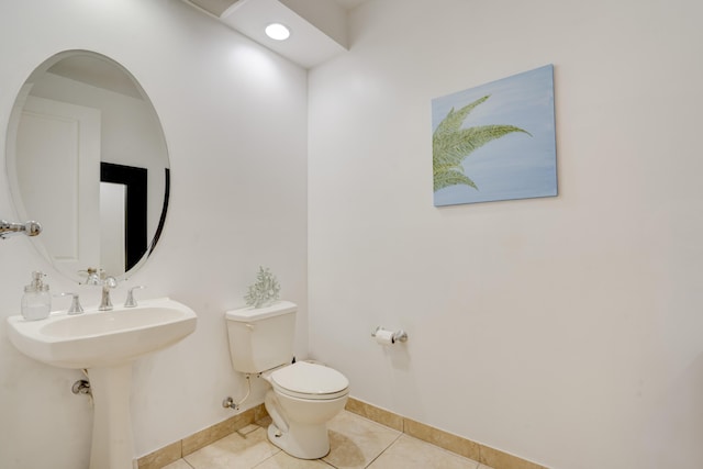 bathroom with tile patterned floors, toilet, and sink