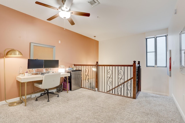 carpeted office with ceiling fan