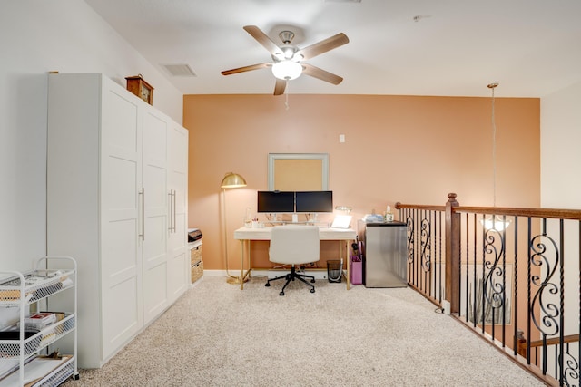 carpeted home office with ceiling fan