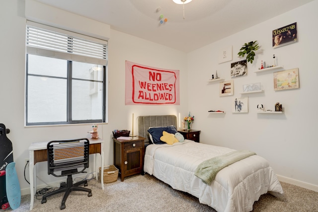 bedroom featuring light colored carpet