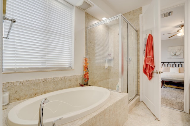 bathroom featuring tile patterned flooring, plus walk in shower, and ceiling fan