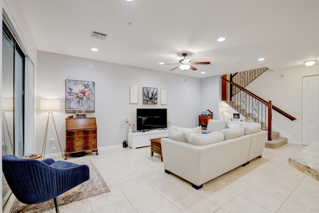 tiled living room featuring ceiling fan