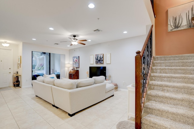 living room with light tile patterned floors and ceiling fan