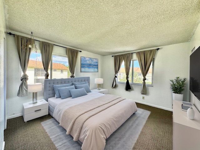 carpeted bedroom with a textured ceiling