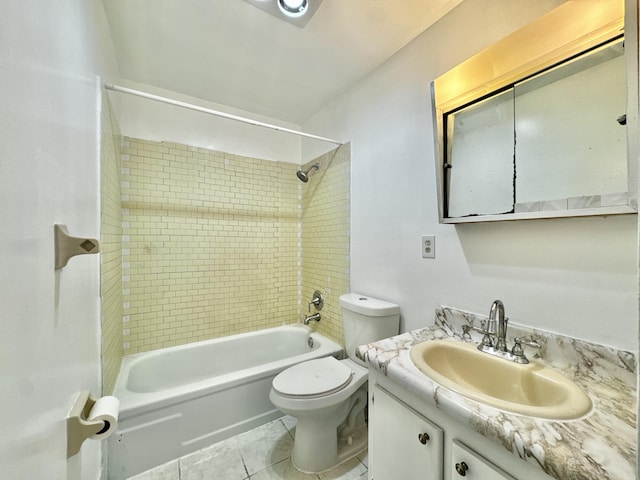 full bathroom featuring vanity, toilet, tile patterned floors, and tiled shower / bath