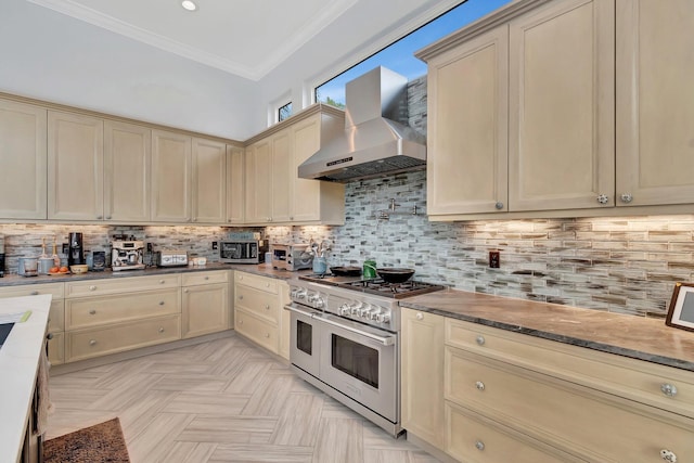 kitchen featuring double oven range, crown molding, exhaust hood, and backsplash