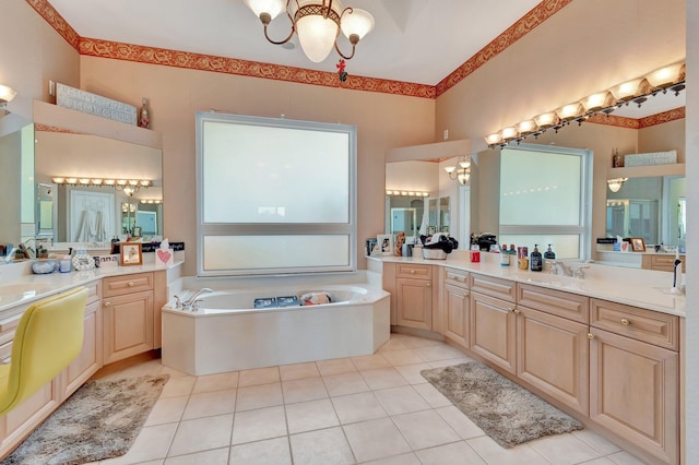 bathroom featuring vanity, a bath, a chandelier, and tile patterned flooring