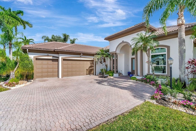 mediterranean / spanish-style house featuring a garage