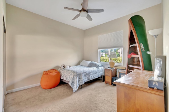 bedroom featuring light carpet and ceiling fan