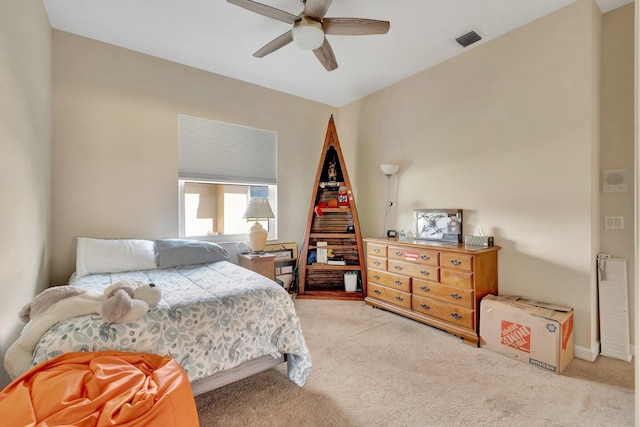 bedroom with ceiling fan and light carpet